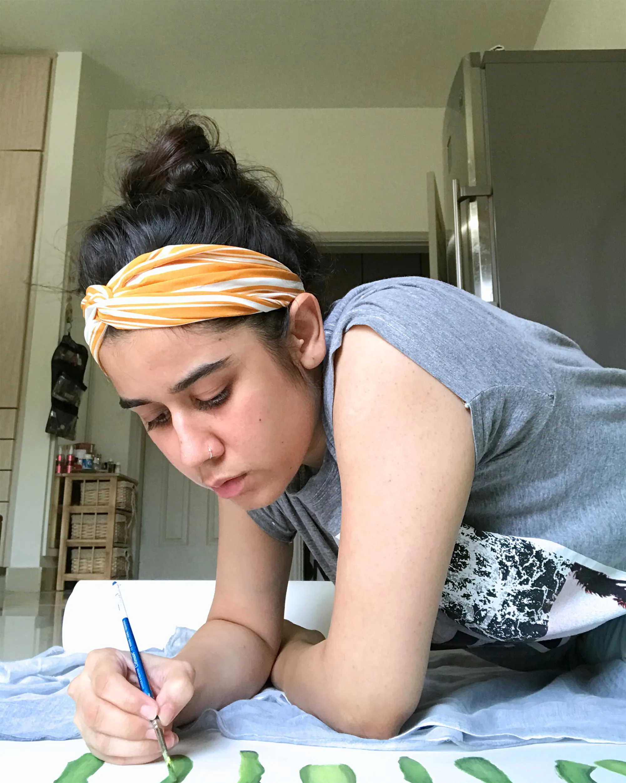 Ajiya working on the scroll